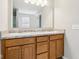 Bathroom vanity with granite countertops, double sinks, and wood cabinetry at 1739 Wedgewood Pl, Avon, IN 46123