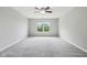 Bright bedroom featuring a window offering natural light, neutral walls, and plush carpeting at 1739 Wedgewood Pl, Avon, IN 46123