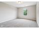 Carpeted bedroom with natural light coming in through a window at 1739 Wedgewood Pl, Avon, IN 46123