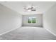Spacious bedroom with ceiling fan and a window providing natural light at 1739 Wedgewood Pl, Avon, IN 46123