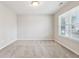 This carpeted bedroom has a window that provides natural light, and neutral-toned walls at 1739 Wedgewood Pl, Avon, IN 46123
