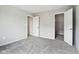 A carpeted bedroom showing the doors and closet space of the residence at 1739 Wedgewood Pl, Avon, IN 46123