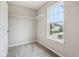 Walk-in closet with installed shelving and a window overlooking the neighborhood at 1739 Wedgewood Pl, Avon, IN 46123