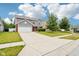 Two-story home with a spacious driveway and lush landscaping in a suburban neighborhood at 1739 Wedgewood Pl, Avon, IN 46123