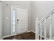Inviting foyer with a white front door, side window, and stylish tile flooring at 1739 Wedgewood Pl, Avon, IN 46123