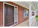 Close-up of front door, brick facade, and well-maintained porch with white trim at 1739 Wedgewood Pl, Avon, IN 46123