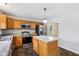 Bright kitchen featuring granite counters, stainless appliances, and center island at 1739 Wedgewood Pl, Avon, IN 46123
