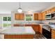 Kitchen with granite counters, stainless steel appliances, and an eat-in island at 1739 Wedgewood Pl, Avon, IN 46123