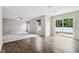 Open-concept living room with carpeted and tiled floors, lots of natural light, and patio door at 1739 Wedgewood Pl, Avon, IN 46123