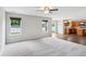 Spacious living room with carpet flooring, large windows, and an open layout at 1739 Wedgewood Pl, Avon, IN 46123
