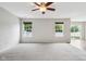 Bright living room with carpet flooring and large windows with backyard views at 1739 Wedgewood Pl, Avon, IN 46123