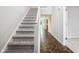 Open staircase with carpeted steps leading to the upper level of the home at 1739 Wedgewood Pl, Avon, IN 46123