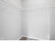 The walk-in closet features a neutral color palette and metal shelving at 1739 Wedgewood Pl, Avon, IN 46123