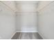 Interior of walk-in closet showing shelving for storage and gray carpeting at 1739 Wedgewood Pl, Avon, IN 46123