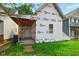 View of exterior, showing protective builder's wrap, door, window, and attached covered entry at 1917 Union St, Indianapolis, IN 46225