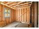 Unfinished interior with visible studs and beams, showing progress of new construction at 1917 Union St, Indianapolis, IN 46225