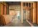 Interior framing of house featuring visible beams, wall studs, and open layout at 1917 Union St, Indianapolis, IN 46225