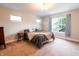 Bright bedroom with carpeted floors and many windows at 2014 W Michigan St, Indianapolis, IN 46222