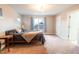 Spacious bedroom featuring carpeted floors, a large bed, and a window at 2014 W Michigan St, Indianapolis, IN 46222