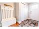 Bright entryway with coat rack, sliding closet, and white door leading to the exterior at 2014 W Michigan St, Indianapolis, IN 46222