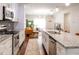Open-concept kitchen with an island, stainless steel appliances, and easy access to living area at 2014 W Michigan St, Indianapolis, IN 46222