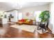 Inviting living room featuring hardwood floors and an open layout with a view of the kitchen at 2014 W Michigan St, Indianapolis, IN 46222