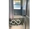 Bathroom featuring a tub/shower combo and grey-blue tile at 2028 Gilmore St, Columbus, IN 47201