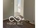 Bright bedroom features neutral walls, modern carpet, and a doorway opening to the bathroom at 2028 Gilmore St, Columbus, IN 47201