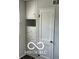 Bedroom closet features drawers, shelves, and a full-length door for ample storage space at 2028 Gilmore St, Columbus, IN 47201