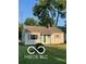 Inviting single-story home with well-manicured lawn, neutral siding, and inviting front door at 2028 Gilmore St, Columbus, IN 47201