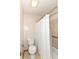 Full bathroom featuring a toilet and bathtub/shower with a shower curtain at 206 Banbury Rd, Noblesville, IN 46062