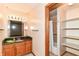 Bathroom featuring vanity with a dark countertop, mirror and a shower/tub combo at 206 Banbury Rd, Noblesville, IN 46062