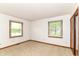 Carpeted bedroom with bright windows and a closet at 206 Banbury Rd, Noblesville, IN 46062