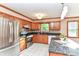 Functional kitchen with stainless steel appliances, wooden cabinetry, and an island at 206 Banbury Rd, Noblesville, IN 46062