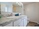 Bright bathroom with double vanity, granite countertops, and modern fixtures at 2101 Shadow Fox Dr, Columbus, IN 47201
