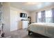 Bedroom featuring neutral walls, gray carpet, a window, and a large dresser at 2101 Shadow Fox Dr, Columbus, IN 47201