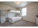 Bedroom features a bunk bed with a plush carpet and neutral walls at 2101 Shadow Fox Dr, Columbus, IN 47201