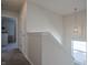Bright hallway featuring neutral walls, gray carpet, and modern pendant lighting at 2101 Shadow Fox Dr, Columbus, IN 47201