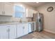 Open kitchen featuring stainless steel appliances and modern white cabinets at 2101 Shadow Fox Dr, Columbus, IN 47201