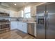 Well-lit kitchen with stainless steel appliances and sleek laminate countertops at 2101 Shadow Fox Dr, Columbus, IN 47201
