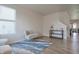 Spacious living room with wood flooring, stylish decor, and an open layout to the dining area at 2101 Shadow Fox Dr, Columbus, IN 47201