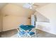 Finished attic space with carpet, table, and seating at 239 E 11Th St, Indianapolis, IN 46202