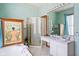 Relaxing bathroom featuring a soaking tub, walk-in shower, and marble countertops for a luxurious experience at 239 E 11Th St, Indianapolis, IN 46202