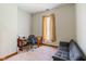Minimalist bedroom with desk, futon couch, and carpeted floors, ideal for an office space at 239 E 11Th St, Indianapolis, IN 46202