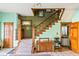 Elegant foyer showcasing a classic staircase, vintage decor, and tiled floors at 239 E 11Th St, Indianapolis, IN 46202