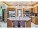Eat-in kitchen with stainless steel appliances, tile countertops, and an island with seating for casual dining at 239 E 11Th St, Indianapolis, IN 46202