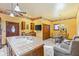 Open kitchen and living area with breakfast nook, wood cabinets, tile countertops, and comfortable seating at 239 E 11Th St, Indianapolis, IN 46202