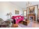 Cozy living area features a fireplace, red sofa and elegant decor at 239 E 11Th St, Indianapolis, IN 46202