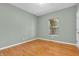 Bedroom showcasing neutral walls, hardwood floors, one window, and white trim at 2948 Chalbury Dr, Plainfield, IN 46168