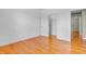 Bedroom featuring hardwood floors and neutral walls; open closet door at 2948 Chalbury Dr, Plainfield, IN 46168